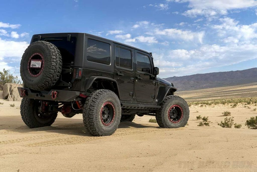 Black jeep jk with 38" mud terrain off-road tires