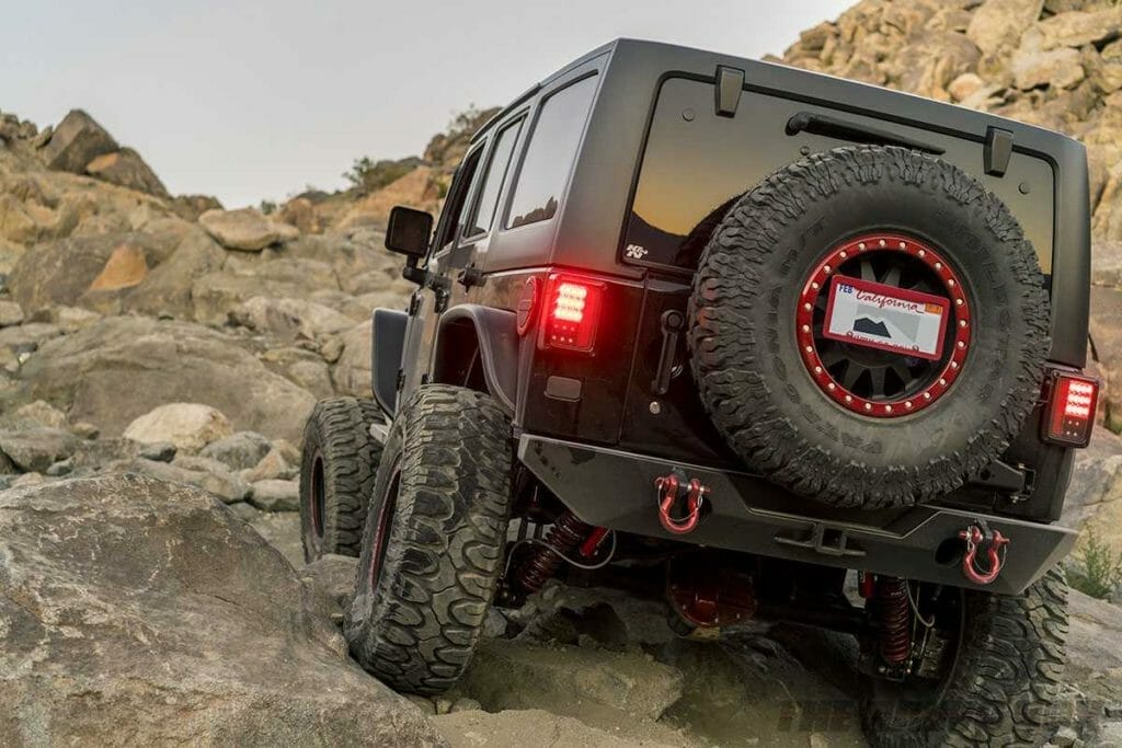 Black jeep jk with 38" mud terrain off-road tires
