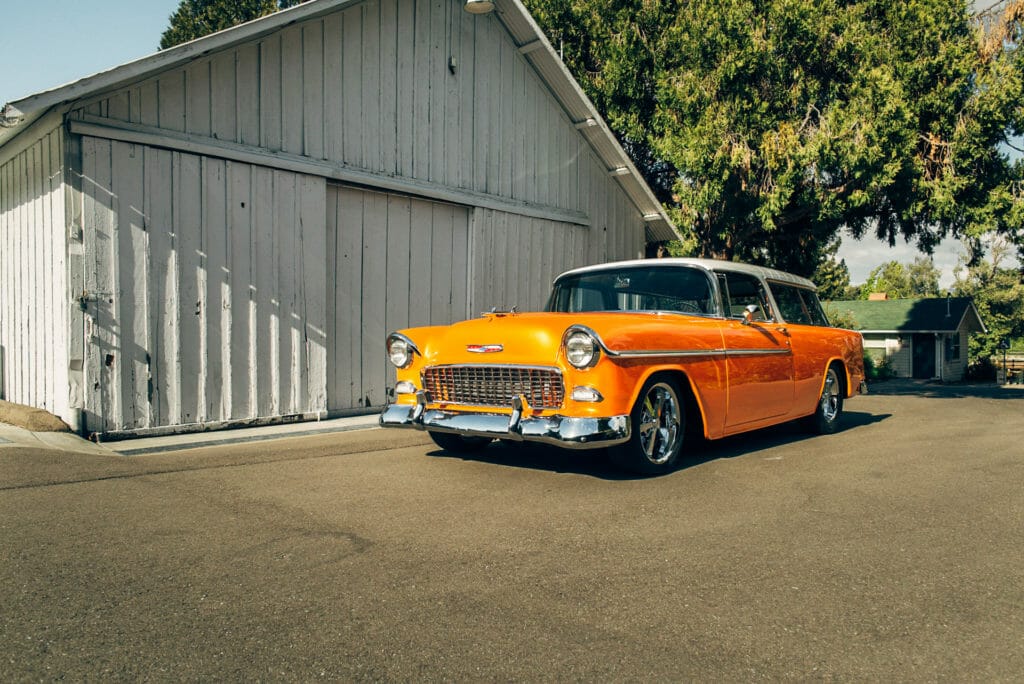 front 3/4 view of Brian Hill of Hill’s Rod and Custom Orange Modified 1955 Chevy Nomad