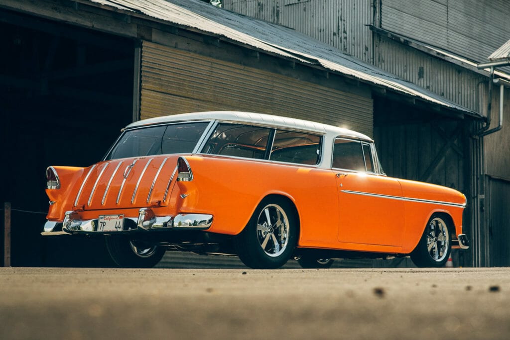 rear three-quarter view of Brian Hill of Hill’s Rod and Custom Orange Modified 1955 Chevy Nomad