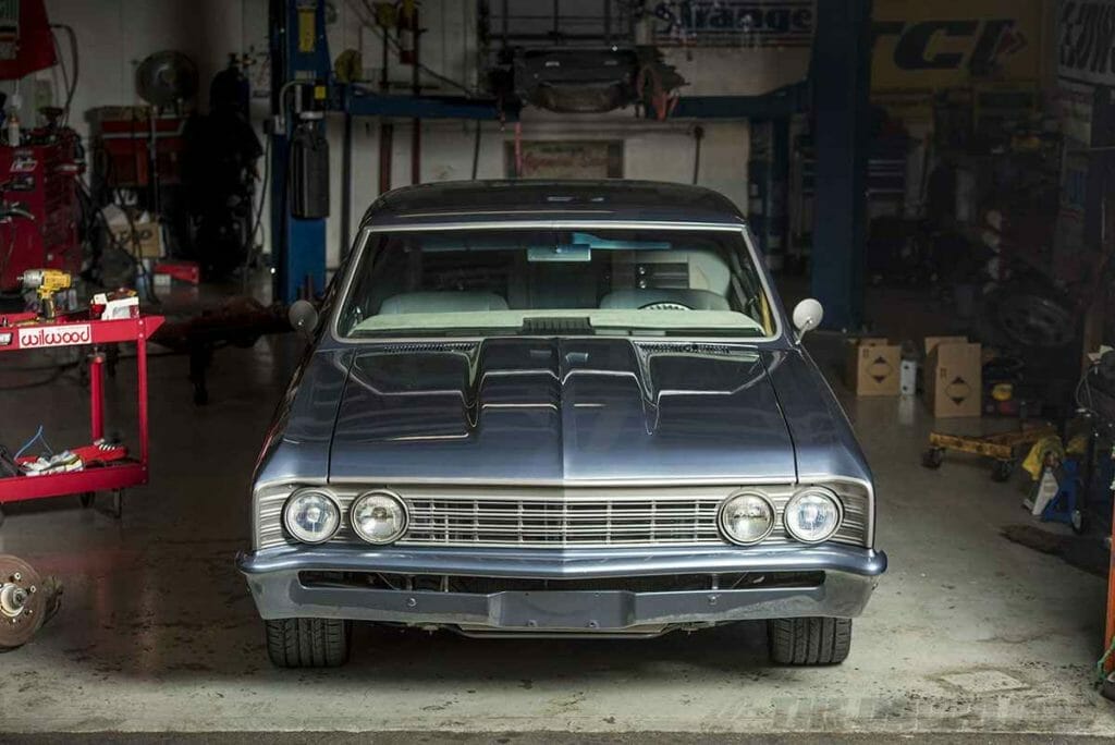 Blue classic chevelle in a garage