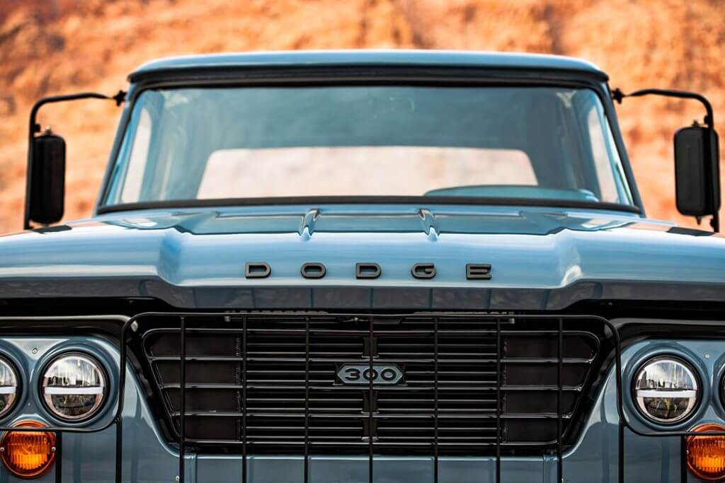 Close up shot of a ceramic blue Dodge W300's front grill