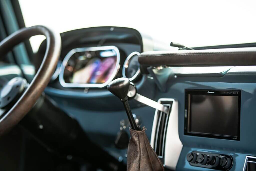 Interior shot of Hodson's muted blue Dodge truck