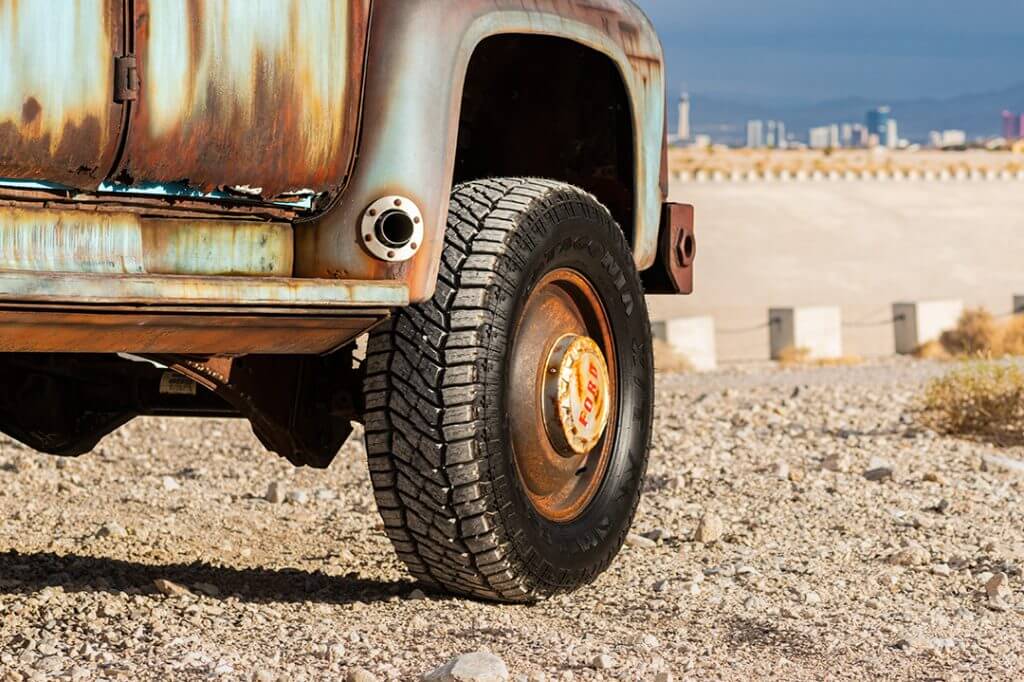 wheel close up of rusty ford f600 dually on Milestar Patagonia X/T 37X12.50 R20 LT Tires