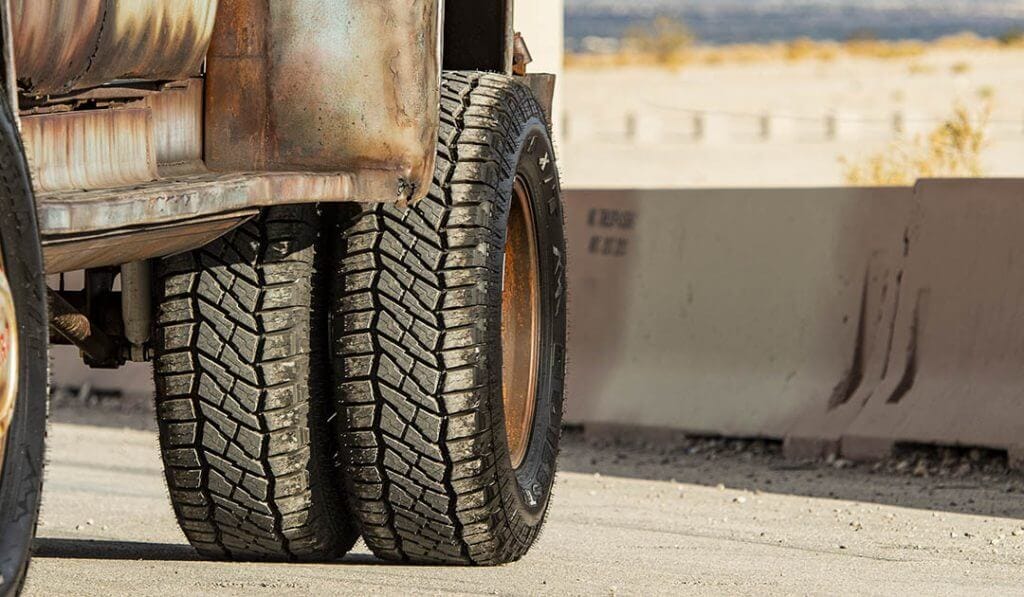 wheel close up of rusty ford f600 dually on Patagonias