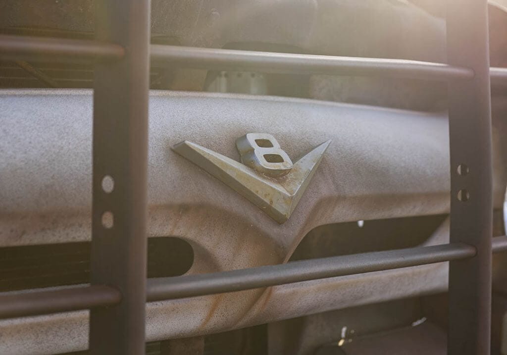 V8 Badge on rusty Hodson Ford f600 dually on patagonia tires