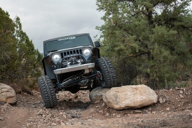 MS_XPDN1_32 jeep crawling over boulders while overlanding
