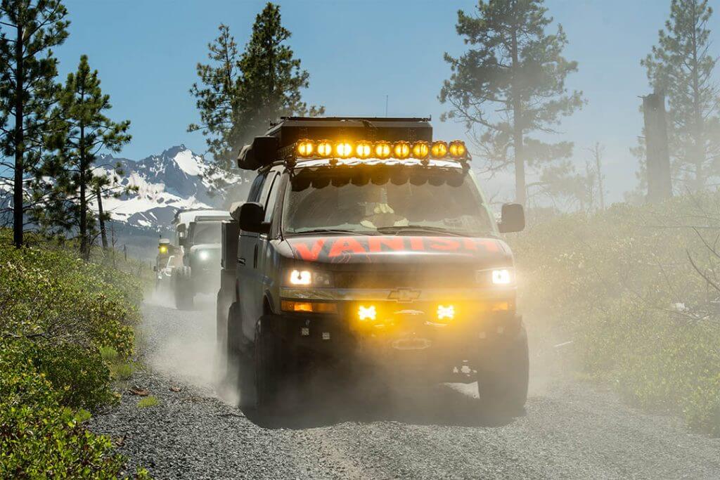 gray chevrolet on a gravel road followed by a jeep in Deschutes National Forest