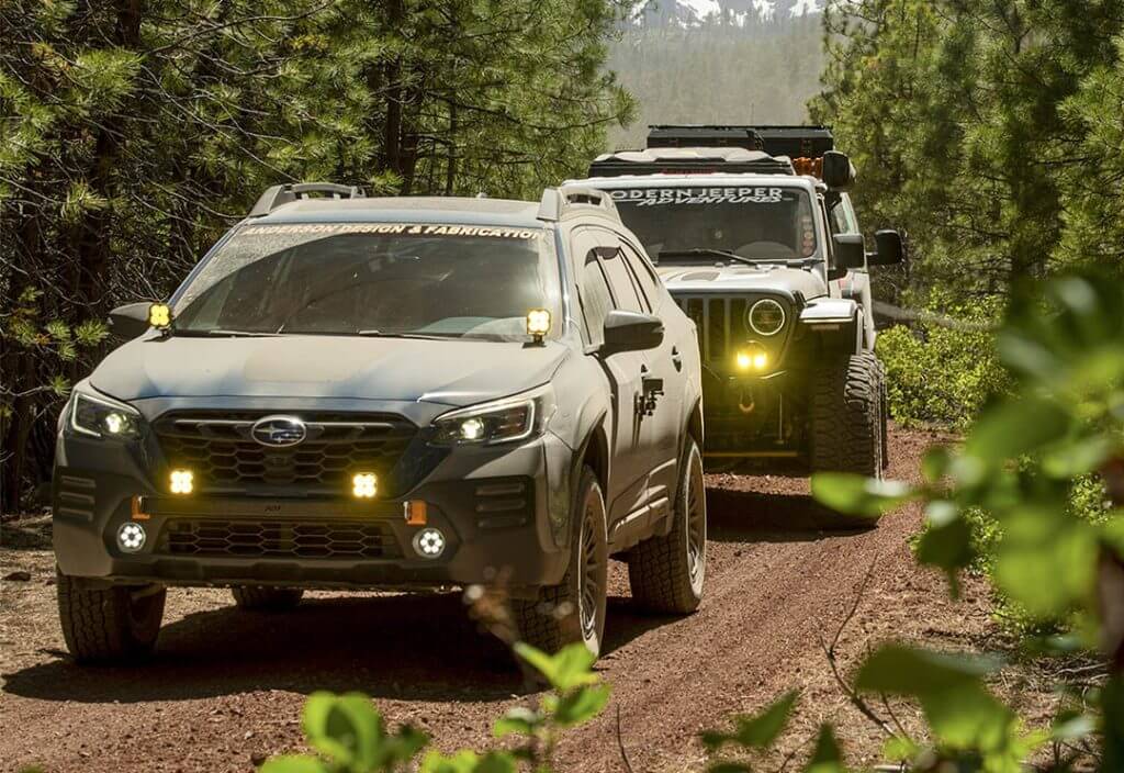 Dusty blue subaru wilderness followed by a gray jeep on a trail in deschutes national forest