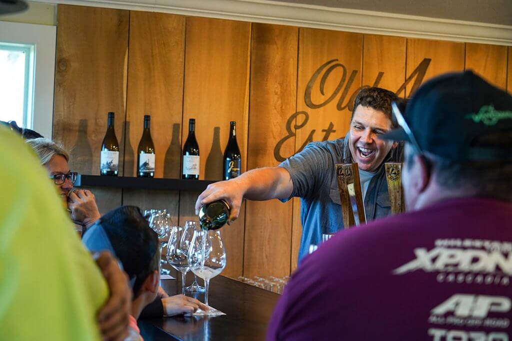 Bartender pours wine for the XPDN 4 crew